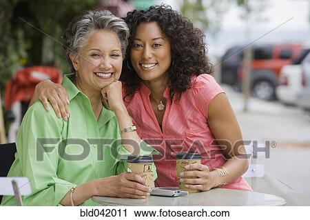 African American mother and adult daughter hugging View Large Photo Image Stock Image - African American mother and adult daughter hugging. Fotosearch
