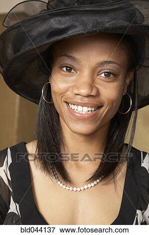 Stock Photo - African American woman dressed for church. Fotosearch