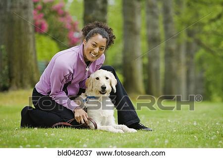 African American woman with dog View Large Photo Image Stock Photo - African American woman with dog. Fotosearch