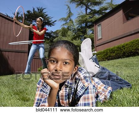 African boy laying in grass View Large Photo Image Stock Image - African boy laying in grass. Fotosearch