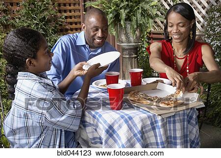 African family eating pizza View Large Photo Image Stock Image - African family eating pizza. Fotosearch