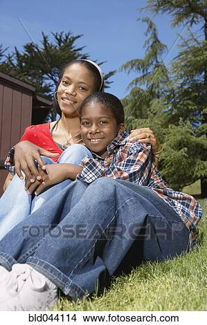 Picture - African mother and son hugging. Fotosearch