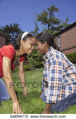 Stock Photography - African mother and son smiling at each other. Fotosearch