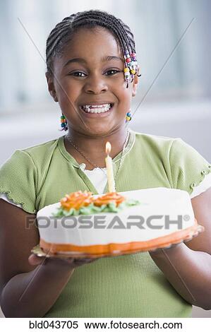 Stock Image of African American girl holding birthday cake bld043705 ...