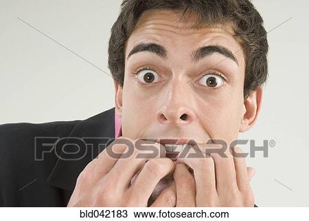 Businessman with fingers in mouth View Large Photo Image Stock Image - Businessman with fingers in mouth. Fotosearch