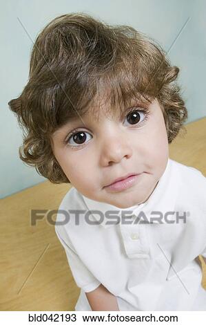 Stock Image - Close up of Hispanic boy. Fotosearch