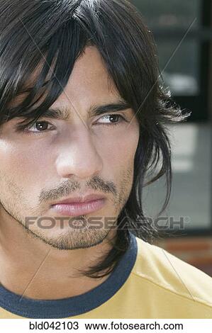 Stock Image - Close up of Hispanic man. Fotosearch