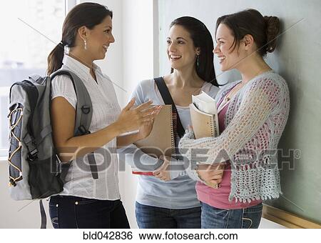 Stock Photograph - Female college students in classroom. Fotosearch