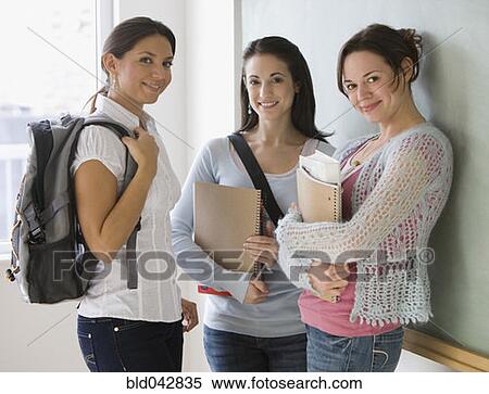 Stock Photography - Female college students in classroom. Fotosearch