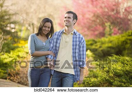 Hispanic couple holding hands View Large Photo Image Picture - Hispanic couple holding hands. Fotosearch