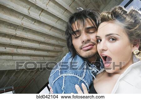 Hispanic couple hugging View Large Photo Image Picture - Hispanic couple hugging. Fotosearch
