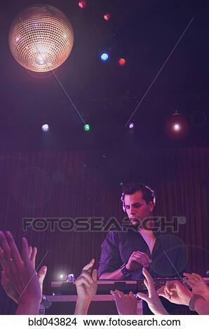 Hispanic dj playing at nightclub View Large Photo Image Picture - Hispanic dj playing at nightclub. Fotosearch