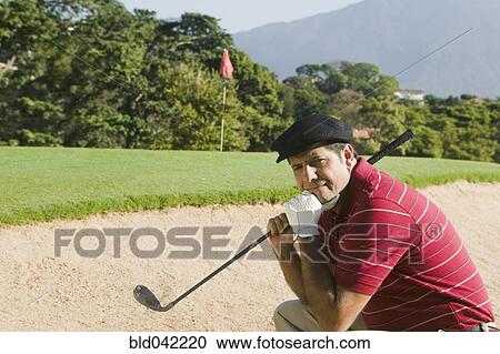 Hispanic man in golf course sand trap View Large Photo Image Stock Image - Hispanic man in golf course sand trap. Fotosearch