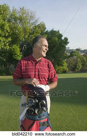 Hispanic man on golf course View Large Photo Image Stock Image - Hispanic man on golf course. Fotosearch