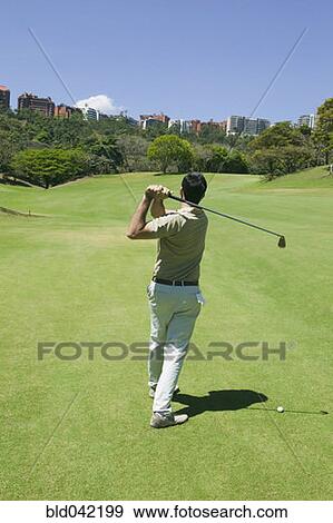 Hispanic man playing golf View Large Photo Image Stock Photo - Hispanic man playing golf. Fotosearch