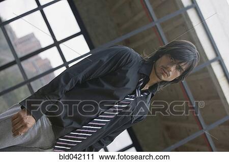 Stock Image - Hispanic man wearing tie. Fotosearch