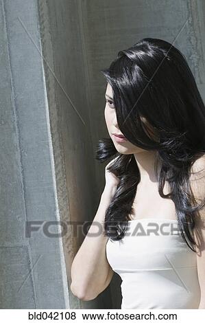 Hispanic woman with long hair View Large Photo Image Stock Photo - Hispanic woman with long hair. Fotosearch