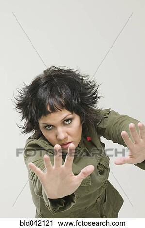 Hispanic women with hands up View Large Photo Image Stock Image - Hispanic women with hands up. Fotosearch