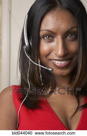 Indian businesswoman wearing headset View Large Photo Image Stock Image - Indian businesswoman wearing headset. Fotosearch