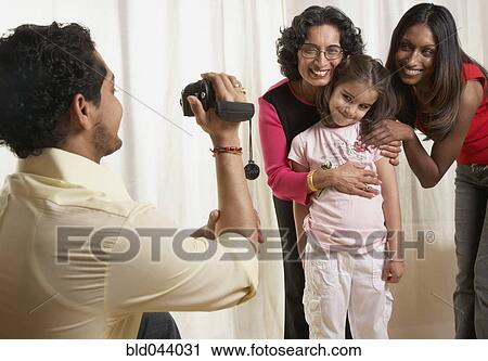 Indian father video recording family View Large Photo Image Stock Image - Indian father video recording family. Fotosearch