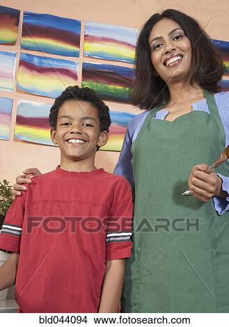 Indian female art teacher and student View Large Photo Image Picture - Indian female art teacher and student. Fotosearch
