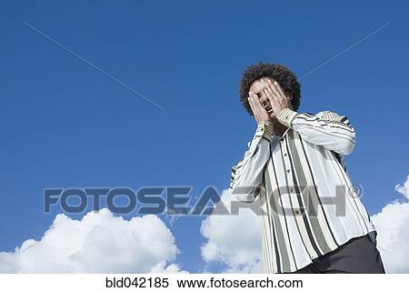 Mixed Race man with hands on face View Large Photo Image Stock Photography - Mixed Race man with hands on face. Fotosearch