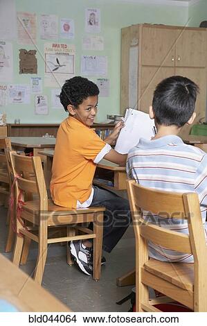 Picture - Multi-ethnic boys in classroom. Fotosearch
