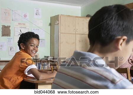 Multi-ethnic boys in classroom View Large Photo Image Stock Photo - Multi-ethnic boys in classroom. Fotosearch