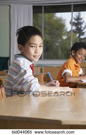 Multi-ethnic boys in classroom View Large Photo Image Stock Photography - Multi-ethnic boys in classroom. Fotosearch