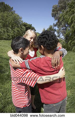 Multi-ethnic children in huddle View Large Photo Image Stock Photo - Multi-ethnic children in huddle. Fotosearch