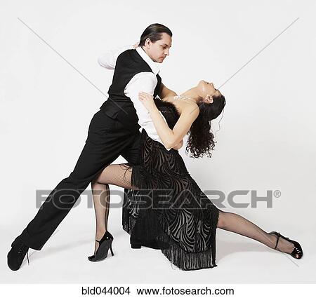 Multi-ethnic couple tango dancing View Large Photo Image Picture - Multi-ethnic couple tango dancing. Fotosearch