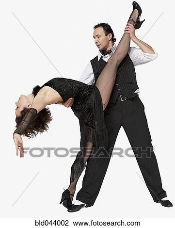 Stock Image - Multi-ethnic couple tango dancing. Fotosearch