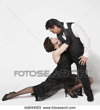Multi-ethnic couple tango dancing View Large Photo Image Stock Image - Multi-ethnic couple tango dancing. Fotosearch