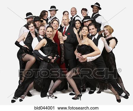 Stock Image - Multi-ethnic people posing in tango outfits. Fotosearch