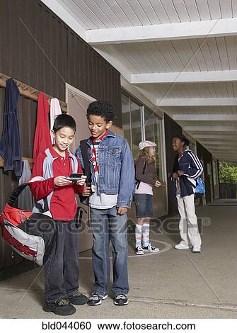 Multi-ethnic school children outside building View Large Photo Image Stock Image - Multi-ethnic school children outside building. Fotosearch