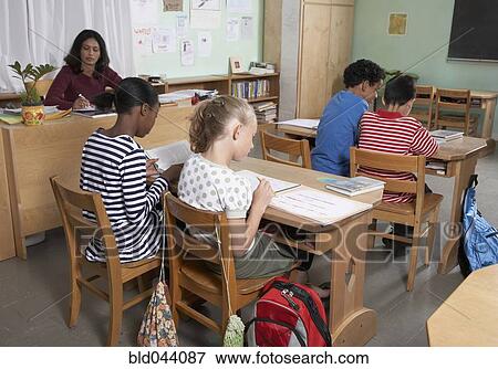 Multi-ethnic students in class View Large Photo Image Stock Photo - Multi-ethnic students in class. Fotosearch