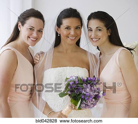 Stock Photo - Portrait of Hispanic bride and bridesmaids. Fotosearch