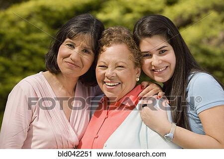 Stock Image - Portrait of multi-generational Hispanic female family members. Fotosearch