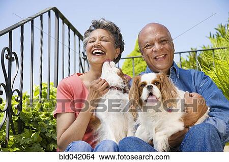 Senior African American couple with dogs View Large Photo Image Picture - Senior African American couple with dogs. Fotosearch