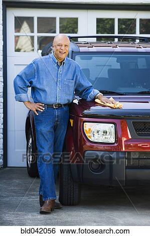 Senior African American man polishing car View Large Photo Image Stock Photograph - Senior African American man polishing car. Fotosearch