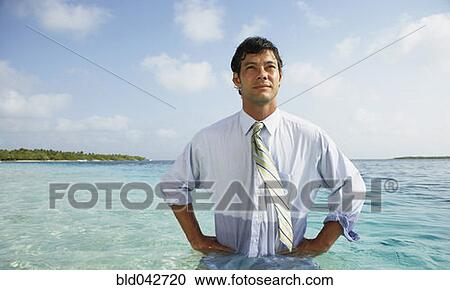 Stock Image - South American businessman in water. Fotosearch
