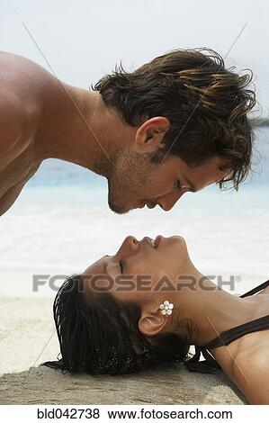 Stock Photo - South American couple about to kiss. Fotosearch