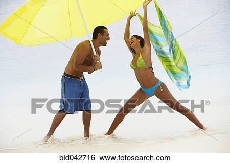 South American couple at beach View Large Photo Image Stock Photograph - South American couple at beach. Fotosearch