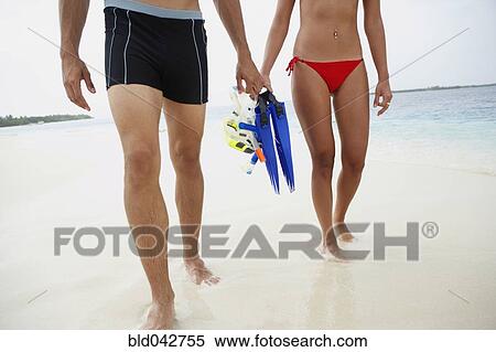 South American couple carrying snorkeling gear View Large Photo Image Stock Photography - South American couple carrying snorkeling gear. Fotosearch
