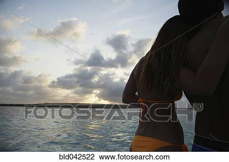 South American couple hugging on beach View Large Photo Image Stock Image - South American couple hugging on beach. Fotosearch