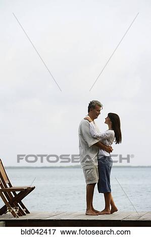 South American couple hugging on dock View Large Photo Image Stock Photo - South American couple hugging on dock. Fotosearch