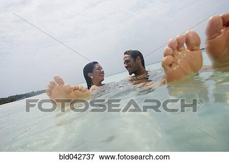 South American couple in water View Large Photo Image Stock Photo - South American couple in water. Fotosearch