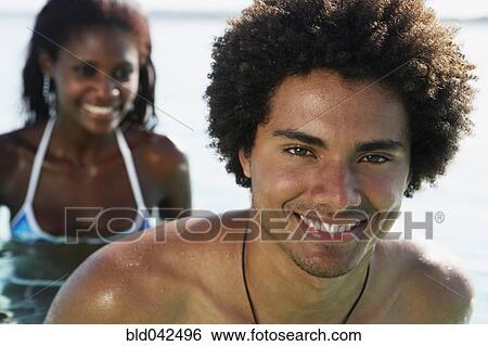 Stock Photograph - South American couple in water. Fotosearch