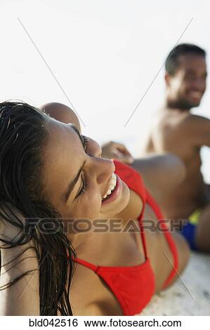 South American couple laying on beach View Large Photo Image Stock Photograph - South American couple laying on beach. Fotosearch