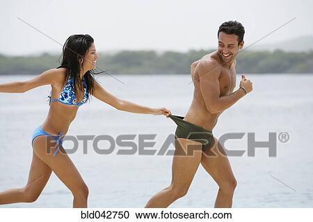 South American couple playing at beach View Large Photo Image Stock Image - South American couple playing at beach. Fotosearch